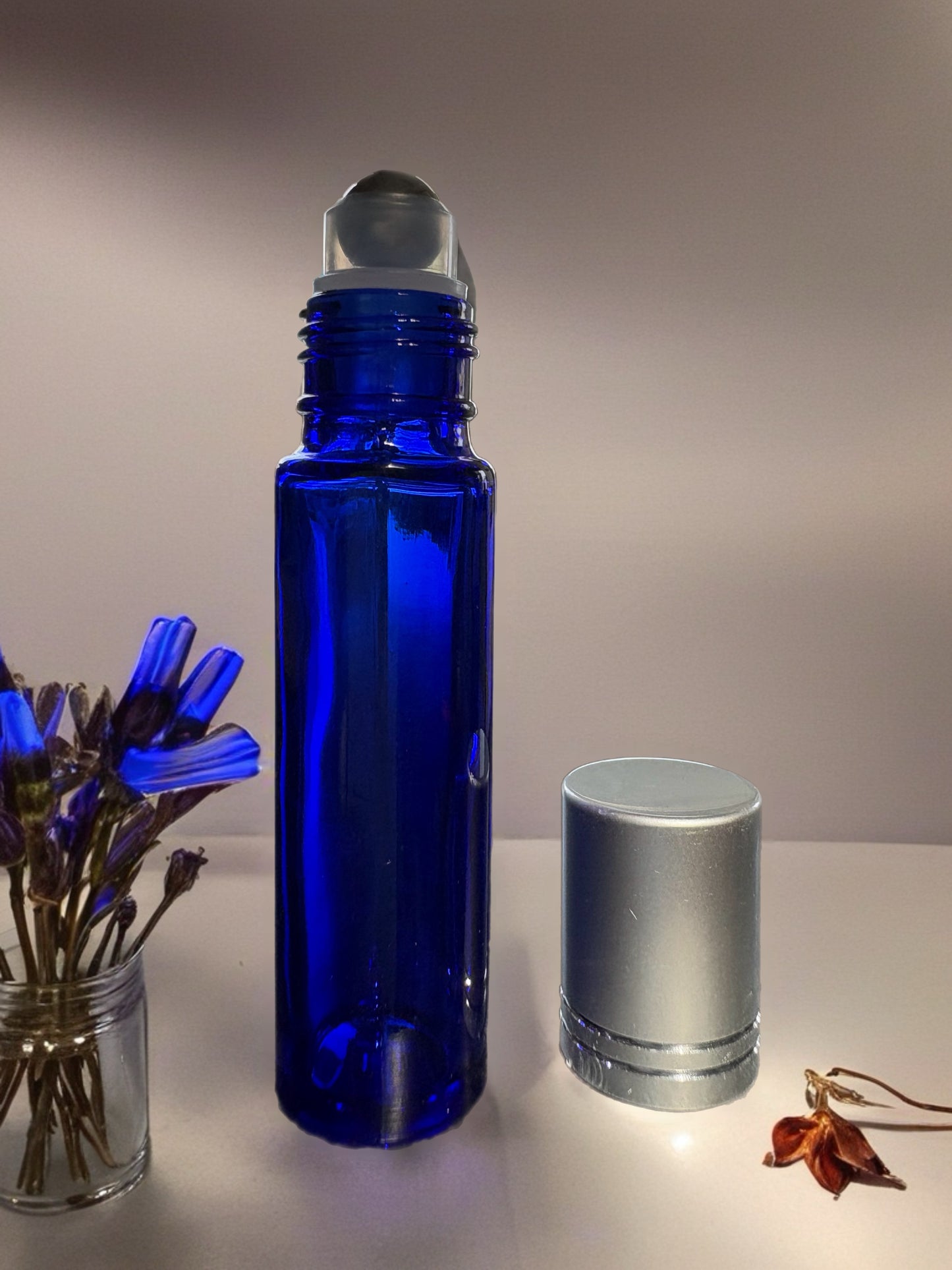10mL Rollerball Glass Bottle with silver coloured cover. Variants pink, blue, or green.